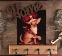 Rustic wall decor with a Chihuahua portrait, 'Home' sign, and key hooks.