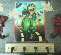 Whimsical painting of a dog riding a green scooter, surrounded by decorative hooks and autumn leaves.